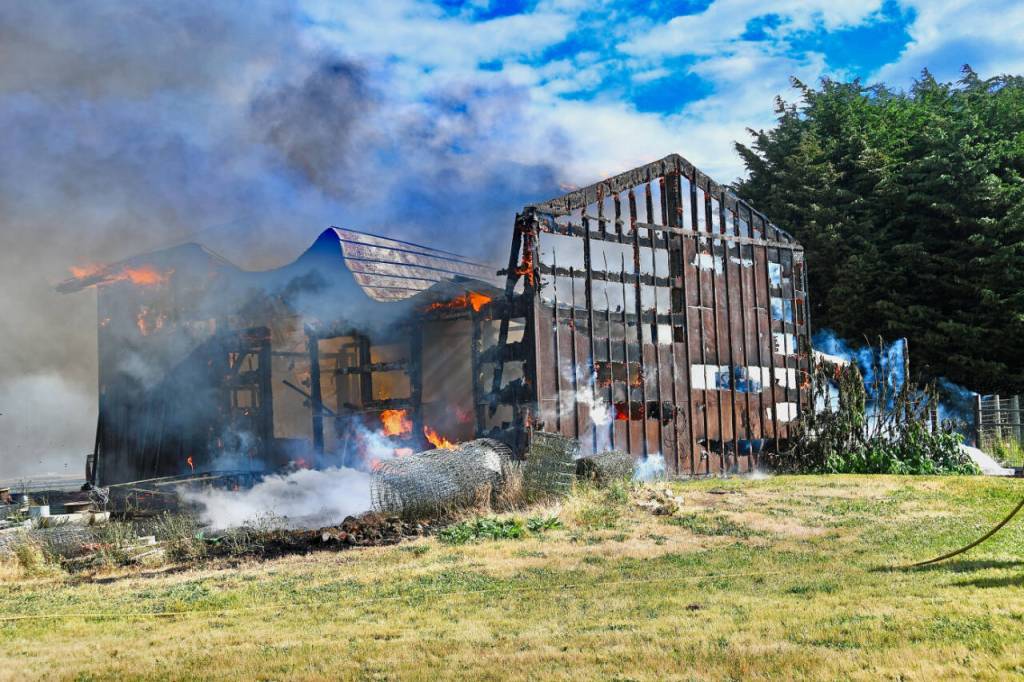Photo by Jay Cline/Fire District 2 A shop is a total loss and a garage damaged in a June 30 fire in the Agnew area on June 30. A nearby residence was undamaged and no one was hurt in the incident, Fire District 3 officials said.