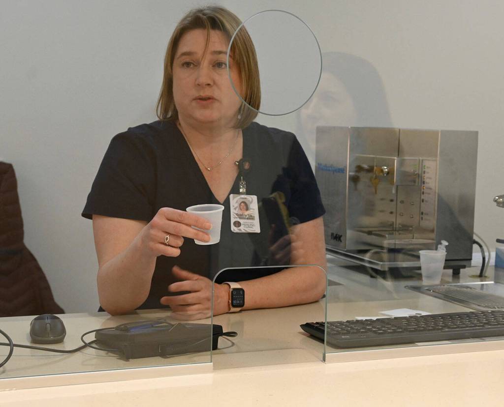 Sequim Gazette photo by Michael Dashiell/ In March, Cristi Biddle, lead dispensing nurse, shows how she prepares a dose of methadone inside a dosing room at the soon-to-open Jamestown SKlallam Tribe Healing Clinic.