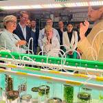 Sequim Gazette photo by Matthew Nash/ Scott Edmundson, a PNNL-Sequim research botanist, speaks at PNNL-Sequims seawater propagation station on Aug. 10 with Jennifer Granholm, U.S. Secretary of Energy, U.S. representative Derek Kilmer, Dr. Geri Richmond, DOEs undersecretary for Science and Innovation, and others about PNNL-Sequims efforts to harness essential minerals from marine algae.