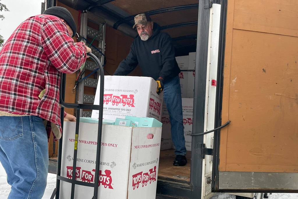 Sequim Gazette photo by Matthew Nash/
Jeff McFarland helps Gary Dills unload boxes of toys to be sorted for local agencies and families through Toys for Tots this Christmas.