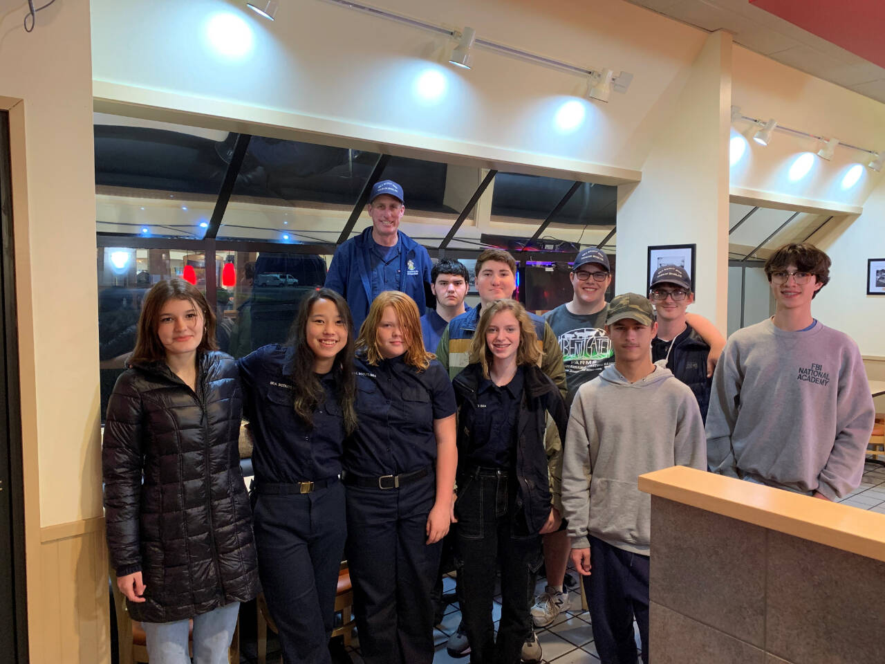 Submitted photo
Sea Scout unit members deliver a Thanksgiving meal to an Olympic Medical Center patient and family. Pictured are Bella Sains, Ana Gustafson, Leyla Price, Brenna Murphy, Michael Aranda, Andrew Corson, Elliot Dahlin, Rynn Hays, Adian Carlquist-Bundy, Michael Rodgers and Sea Scout leader Jared Minard. Not pictured are Dean Spaulding, Ella Schulz, Ozzy Minard and Jonathan Bridges.