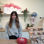 Sequim Gazette photos BY Emily Matthiessen
Amanda Hes shop Be Blossom Boutique holds its grand opening at the end of November. The earrings to the right of He are large but light, and behind are some of the blooming orchids that grace the shop.