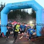 Sequim Gazette photo by Michael Dashiell / Runners break from the starting line of the 2022 Jamestown SKlallam Tribe 5k/10k race on Dec. 3.