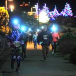 Sequim Gazette photo by Michael Dashiell / Runners and walkers approach the finish line of the 2022 Jamestown SKlallam Tribe 5k/10k race in Blyn on Dec. 3.