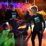 Port Townsends Noah Isenberg, right, and Noah Plotnik of Sequim, center, congratulate Sean Southard of Sequim for is 2022 Jamestown SKlallam Tribe 5k victory on Dec. 3.