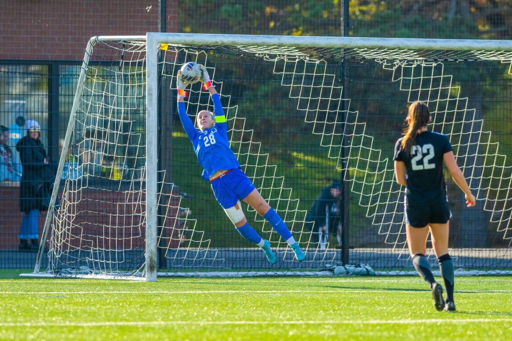 Photo courtesy of WWU Athletics / Claire Henninger makes a save in the NCAA Division II national quarterfinal game. A former Sequim soccer standout, Henninger is a graduate student at Western Washington University and helped the WWU womens soccer team earn its second national title with a 2-1 win over West Chester (Pa.) on Dec. 3.