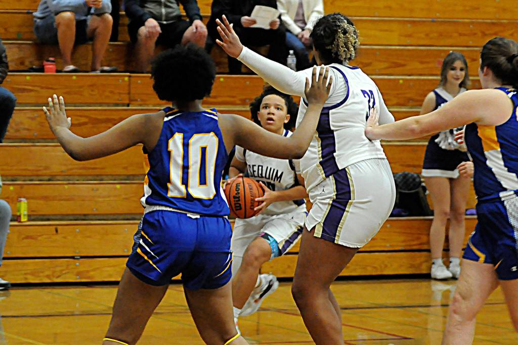 Bobbie Mixon pulls up to the 3-point line to take a shot against Bremerton on Dec. 8. Sequim won 56-43 in the home opener and Mixon recorded eight points, five rebounds, four assists and two blocks.