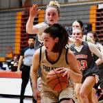 Photo by Jay Cline/Peninsula College
Former Sequim high star Hope Glasser looks to attack the basket in the NWAC tournament semi-final as Peninsula College takes on Clackamas in Everett on March 26.
