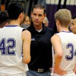 Sequim Gazette file photo by Conor Dowley 
Sequim High head coach Greg Glasser, center, talks to Isaiah Moore, left, and Erik Christiansen during a timeout in the Wolves 51-46 win over North Mason in January 2020.