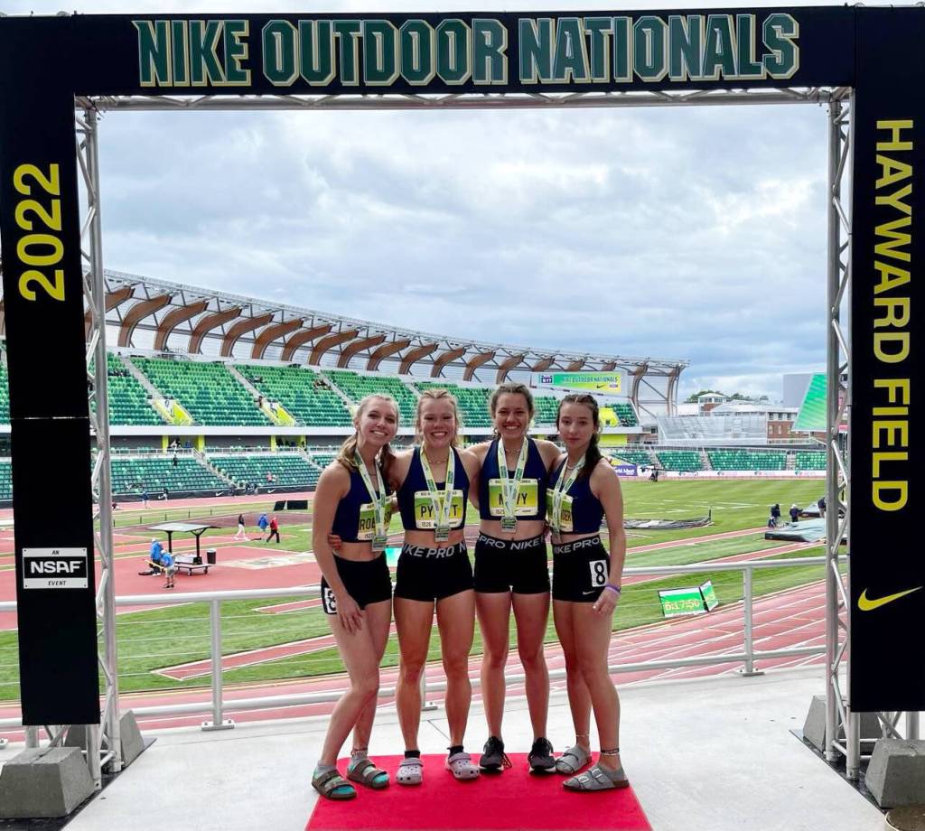 Sequim TC members (from left) Hiilei Robinson, Riley Pyeatt, Eve Mavy and Kaitlyn Bloomenrader celebrate a Emerging Elite championship at the 2022 Nike Outdoor Nationals at the University of Oregons Hayward Field in Eugene, Ore., on June 18. Submitted photo