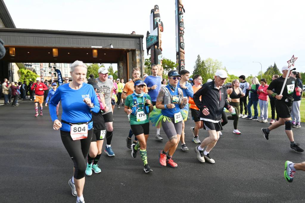 Sequim Gazette photo by Michael Dashiell
Runners break from the starting line of the 2022 North Olympic Discovery marathon at 7 Cedars Resort in Blyn on June 5.
