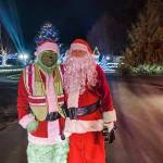 Photo courtesy Santas Toy and Food Fire Brigade/ The Grinch and Santa (Brandon Tucker and Dan Orr) make an appearance during the first night, Dec. 5, of Santas Toy and Food Fire Brigade. It toured through Sequim collecting donations for Sequim Community Aid and Sequim Food Bank through Dec. 9.