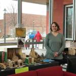 Submitted photo / Olympic Peninsula Academy teacher Rebecca Bullard stands near student dioramas, on display at the Sequim Civic Center through the first week of January.