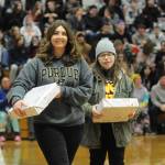 Sequim Gazette photo by Matthew Nash/ At Sequim High Schools Winter Wishes assembly, hundreds of requests were granted, including new laptops for Jill Adolphsen and Trinity McNulty.
