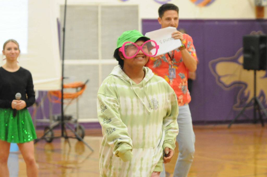 Sophomore Adrian Dulfo smiles after learning his wish was granted to receive a Stanford hoodie through Sequim High Schools Winter Wishes assembly.