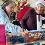 Sequim Gazette photo by Matthew Nash
During Toys for Sequim Kids, Clair Hamaker seeks some toys for her six children with help from event co-organizer Kathy Joyner.