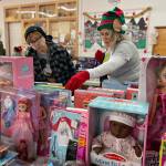 Sequim Gazette photo by Matthew Nash
At Toys for Sequim Kids, Sue Owens looks for just the right toys for one of her four grandchildren with help from volunteer Cynthia Vineyard. This was Vineyards first year helping, she said, and plans to keep helping.