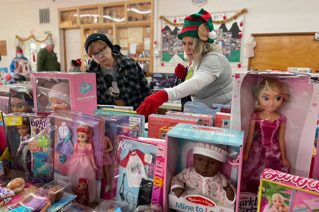 Sequim Gazette photo by Matthew Nash
At Toys for Sequim Kids, Sue Owens looks for just the right toys for one of her four grandchildren with help from volunteer Cynthia Vineyard. This was Vineyards first year helping, she said, and plans to keep helping.