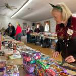 Sequim Gazette photo by Matthew Nash/ Volunteer Linda Richl organizes toys and games at Toys for Sequim Kids in Sequim Prairie Grange on Dec. 14. Ive helped for years and I really enjoy it, she said. I look forward to it every year.