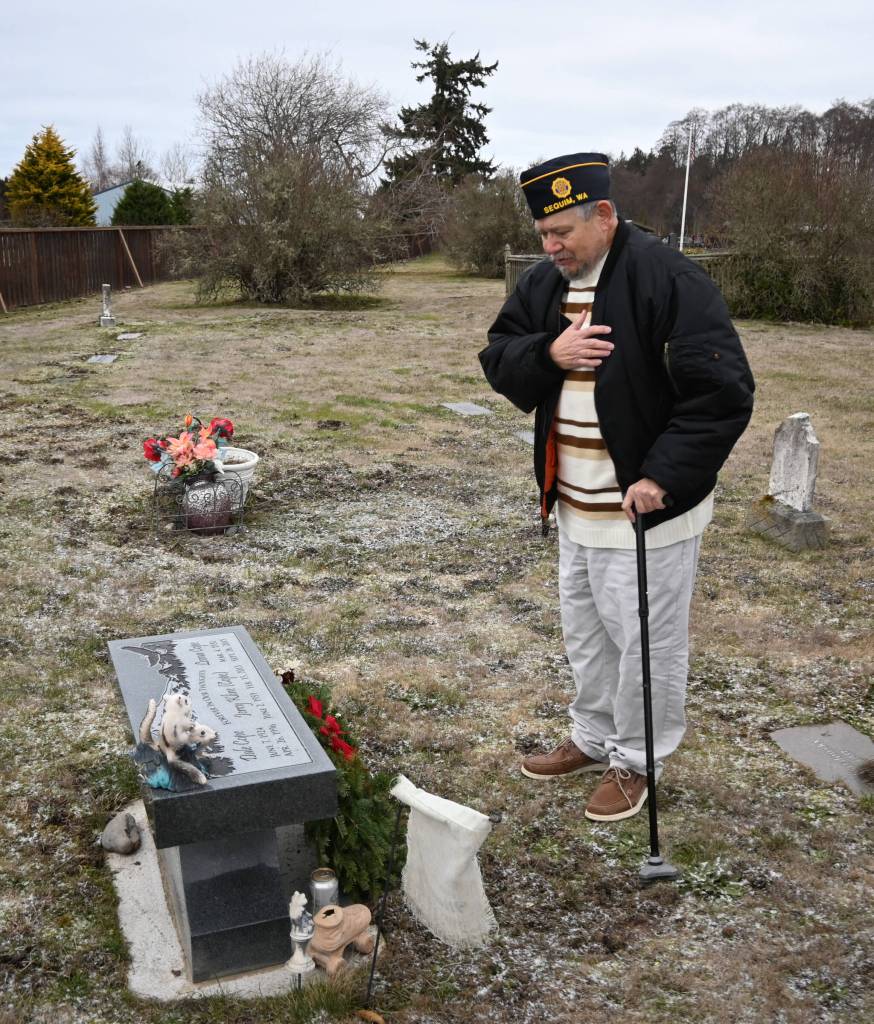 SEQUIM GAZETTE PHOTOS BY MICHAEL DASHIELL
Veteran Victor Knickerbocker pays tribute to his uncle Dale Cope at the Jamestown SKlallam Tribal Cemetery on Dec. 19.