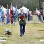 Keith Thorpe/Olympic Peninsula News Group
Cmdr. Brian Tesson, commanding officer of the U.S. Coast Guard Cutter Active, carries a wreath for the grave of Coast Guard veteran Harold Hanusa, who served during World War II, during the Wreaths Across America ceremony at Mount Angeles Memorial Park in Port Angeles on Dec. 17. The event, part of a national initiative to honor veterans of military service, saw individual branches of the military recognized during the ceremony followed by the placement of more than 2,300 wreaths for servicemen and women at six cemeteries across the North Olympic Peninsula.