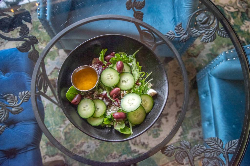 Sequim Gazette photo by Emily Matthiessen / The Greek salad at Wild Goddess Brews-n-Bites, like all the food, can be eaten in store or carried out in a mason jar; a $1 deposit fee will be paid upon the jars return, or the customer can keep for reuse at home.