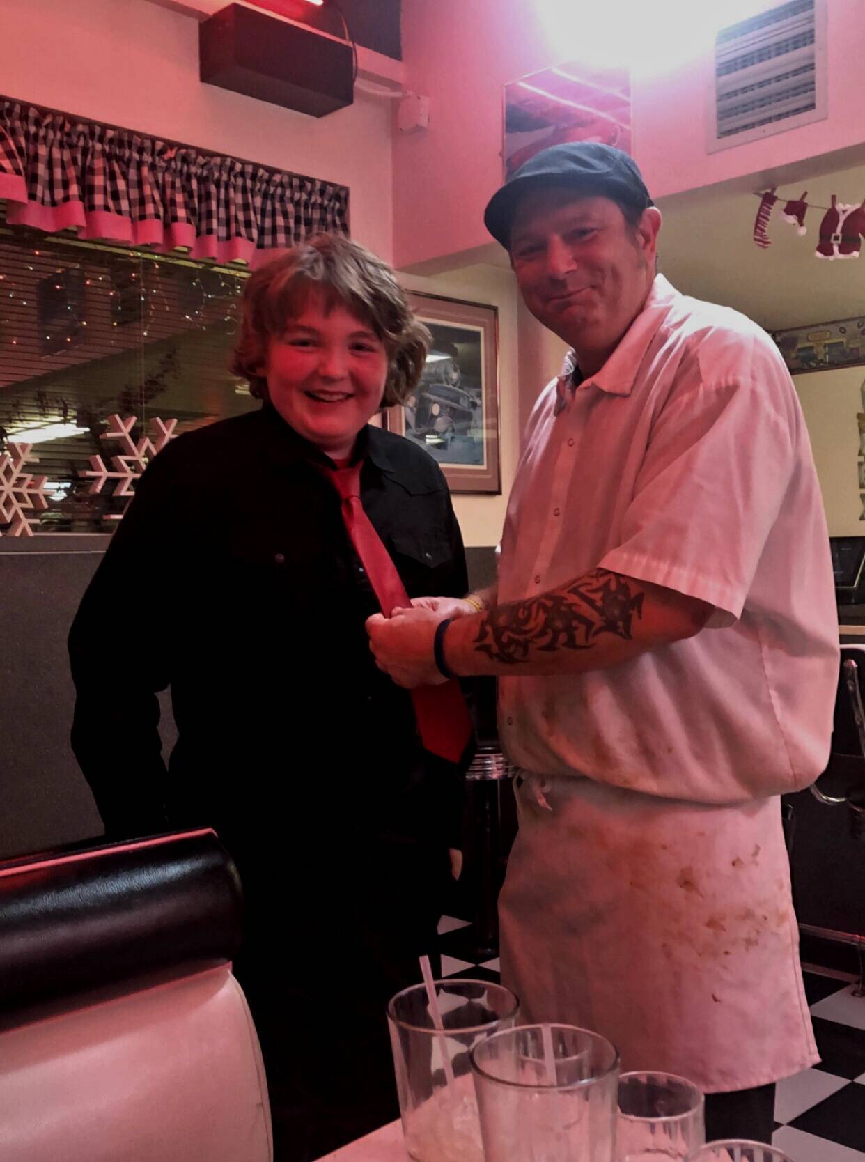 Submitted photo 
Above: Anthony Ingram stands with chef Joshua Hicks at Hi-Way 101 Diner in early December after Hicks helped him tie his tie before a band concert. His grandmother Joanne Tisch said she didnt know how to tie a tie, and asked around the restaurant before Hicks volunteered.