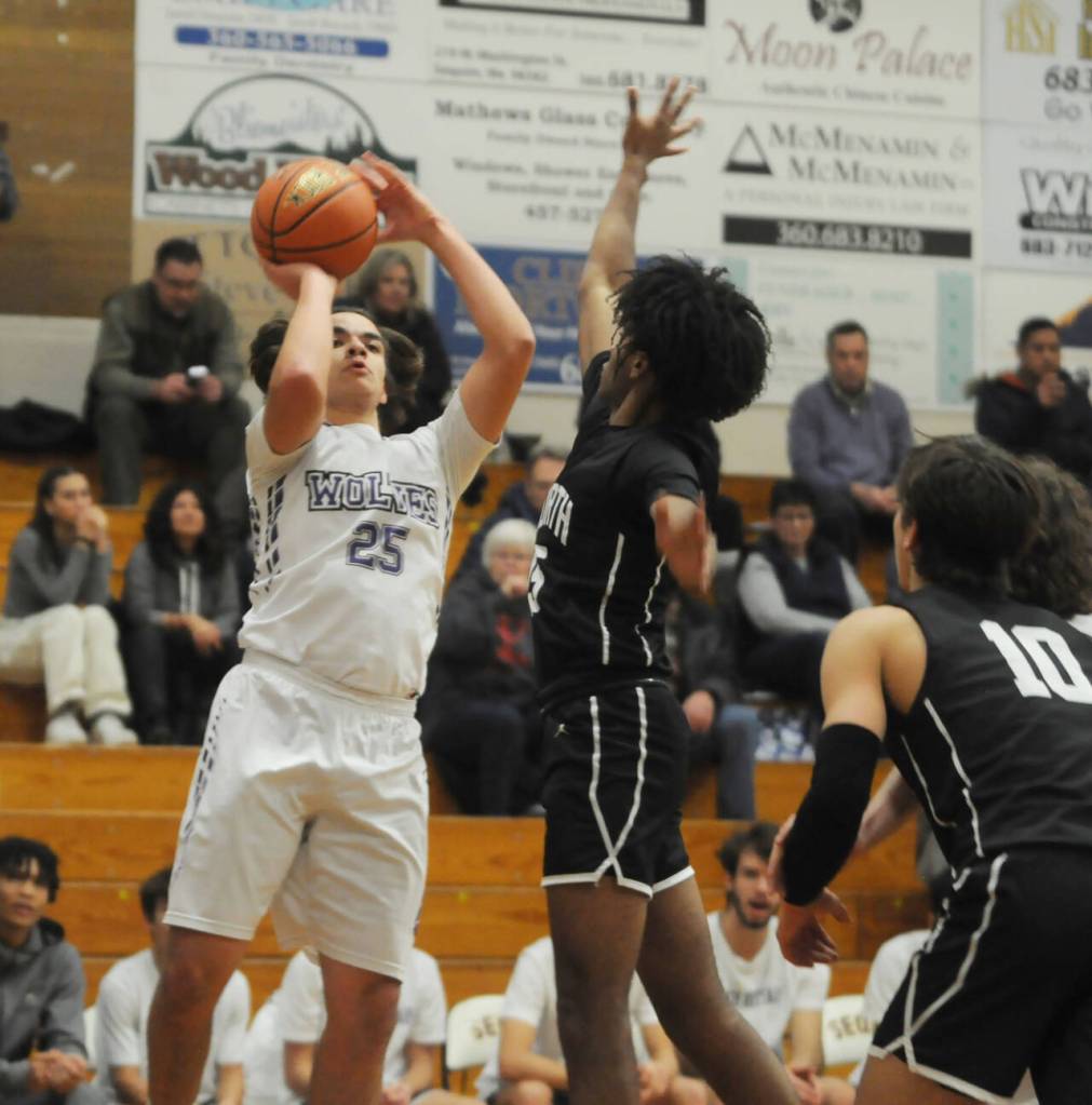 Sequim Gazette photo by Michael Dashiell / Sequims Lars Wiker takes a jumpshot as the Wolves take on North Kitsap on Dec. 19.