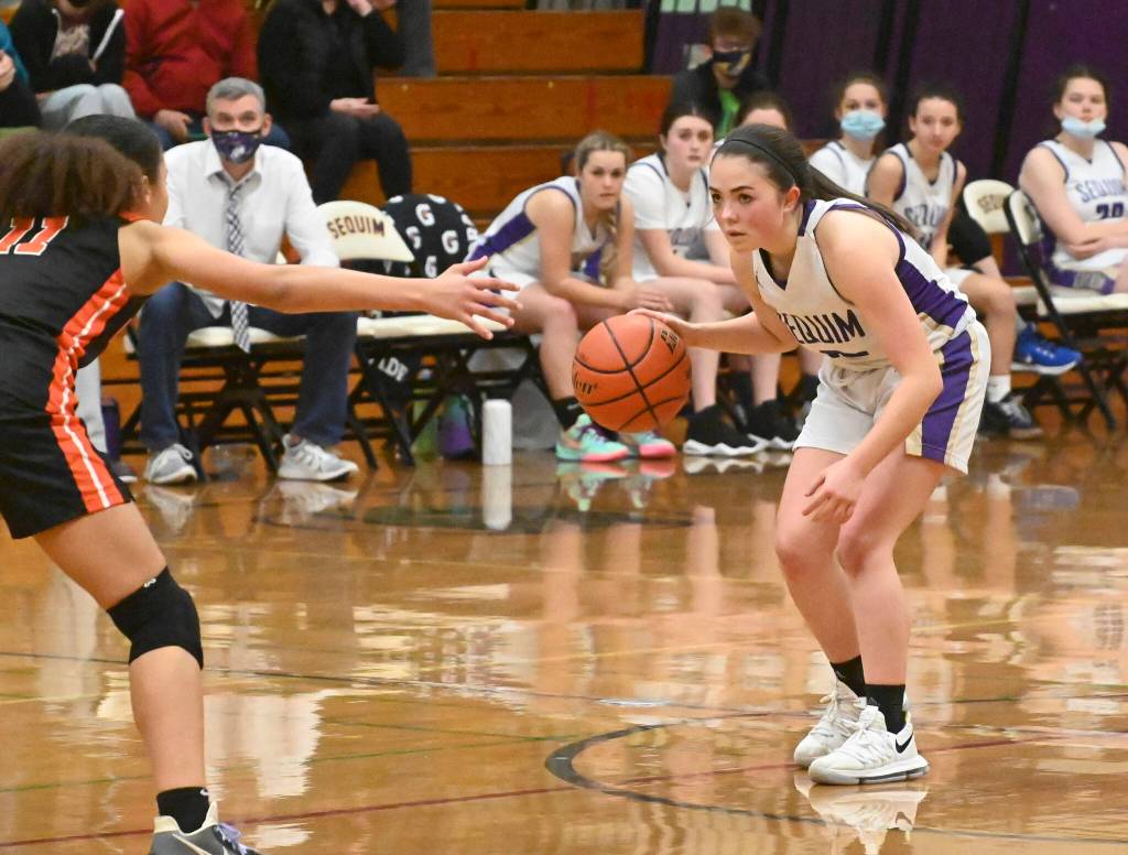 Sequim Gazette file photo by Michael Dashiell / Hannah Bates surveys the court in a December 2021 game against Central Kitsap.