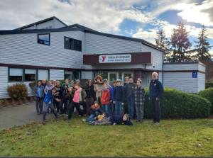Submitted photo / Members of Sequims BSA Troop 1498 and Troop 7498 gather for a community service project at the Sequim YMCA earlier this month.