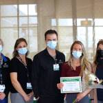 Photo courtesy of Olympic Medical Center / Hannah Nelson, an Olympic Medical Center registered nurse (second from right), receives a DAISY Award for Extraordinary Nurses. Pictured, from left, are Cheri Levy, Jae McGinley, Aaron Possin, Nelson and Vickie Swanson.