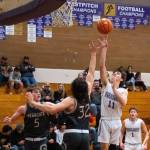 Sequim Gazette photoS by Emily Matthiessen
Sequims Charlie Grider puts up a shot over WF Wests Hunter Lutman (32) and Parker Eiswald (5) in the Wolves 60-44 loss to the visiting Bearcats on Dec. 27.