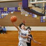 Sequim Gazette photo by Michael Dashiell / Sequim guard Vince Carrizosa drives to the basket past Granite Falls Marcus Klammt in the first half of the Wolves 78-43 win over the visiting Tigers on Dec. 29. Carrizosa had a team-high 15 points.