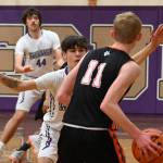 Sequim Gazette photo by Michael Dashiell 
Sequim guard Vince Carrizosa , center, and Cole Smithson guard the basket against Jack McGill and the visiting Granite Falls Tigers on Dec. 29. Sequim won, 78-43.