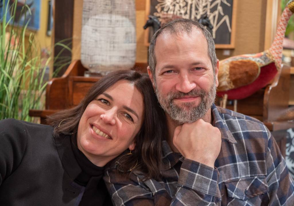 Sequim Gazette photo by Emily Matthiessen / Emily and Scott Underwood, new owners of Over the Fence, now business partners as well as life partners, smile as they speak of future plans for the iconic Sequim store at 118 E. Washington Street.