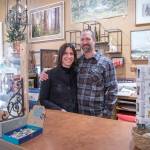 Sequim Gazette photo by Emily Matthiessen / Held by her husband and business partner Scott, Emily Underwood smiles at her parents Jeri and Fran Sanford (not in picture). The Underwoods are the new owners of Over the Fence in Sequim, which they bought from the Sanfords, who plan to visit with friends, travel, garden and have other fun during their retirement, as well as help out at the store occasionally.