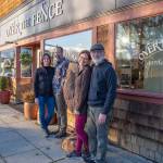Sequim Gazette photo by Emily Matthiessen /Emily Underwood stands with her husband Scott Underwood, left, and her parents Jeri and Fran Sanford stand on the other side of Over the Fences giant metal rooster. The end of 2022 marks the transition of ownership of the store between the two couples.