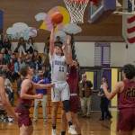 Sequim sophomore Charlie Grider drives through the Kingston defense for a basket in the Wolves 70-56 win on Jan. 3.