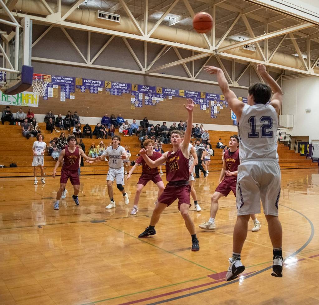 Sequim Gazette photos by Emily Matthiessen
Sequims Espn Judd launches a 3-pointer in Sequims 70-56 home win over Kingston on Jan. 3.