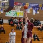 Sequim Gazette photo by Emily Matthiessen / As teammate Charlie Grider, left, looks on, Sequims Zack Thompson looks to get past Kingstons Seth Fortenbacher (3) in SHSs 70-56 home victory on Jan. 3. Thompson had a game-high 19 points.