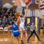 Sequim Gazette photo by Emily Matthiessen / Sequims Jolene Vaara, right, drives past Olympics Sophia Brown for two of her game-high 24 points in the Wolves 64-25 home win over Olympic on Jan. 5.
