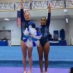 Submitted photo / Klahhane Gymnastics Platinum Team gymnasts Mariah Traband, left, and Kira Hartman cap their efforts in the Snowball Classic in Lakewood on Jan. 7.