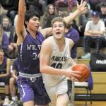 Photos by Keith Thorpe/Olympic Peninsula News Group
Port Angeles Isaiah Shamp, right, pushes past Sequims Isaiah Moore on the way to the lane on Jan. 10 in Port Angeles.