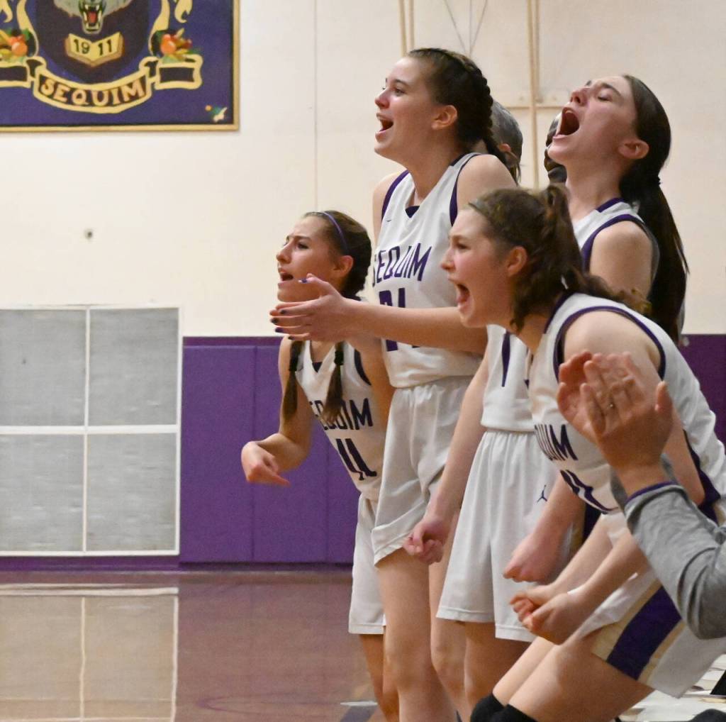 Sequim Gazette photo by Michael Dashiell / Sequim Highs bench erupts after a fourth quarter score in the Wolves 38-31 home win over Bainbridge on Jan. 12. Pictured are, from left, are Taryn Johnson, Dani Hermann, Taylor Heyting and Libby Turella.