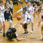 Sequim Gazette photo by Michael Dashiell / Sequim forward Jelissa Julmist, center, steals the ball from Bainbridges Ghadir Ramadan in the fourth quarter of a 38-31 Sequim win on Jan. 12. Looking on are (far left) Sequims Jolene Vaara and Sammie Bacon, and Bainbridges Bella Ramirez (24) and Sierra Berry (23).