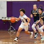 Sequim Gazette photo by Michael Dashiell / Sequim guard Bobbi Mixon, left, races downcourt for a score in the fourth quarter of a 38-31 SHS win over visiting Bainbridge. Chasing Mixon are Spartans Bella Ramirez (24) and Bella Ramirez.