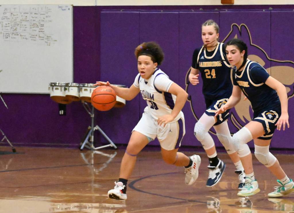 Sequim Gazette photo by Michael Dashiell / Sequim guard Bobbi Mixon, left, races downcourt for a score in the fourth quarter of a 38-31 SHS win over visiting Bainbridge. Chasing Mixon are Spartans Bella Ramirez (24) and Bella Ramirez.