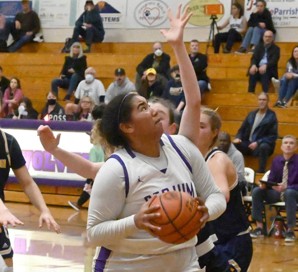 Sequim Gazette photo by Michael Dashiell / Sequims Jelissa Julmist, left, looks to score in the fourth quarter of the Wolves 38-31 win over Bainbridge on Jan 12.