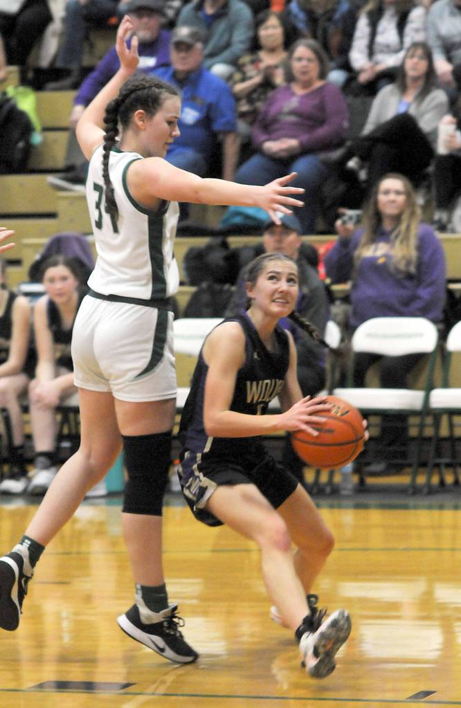 Photo by Keith Thorpe/Olympic Peninsula News Group / Sequims Taryn Johnson, right, steps into the lane as Port Angeles Lexie Smith puts up interference in an Olympic League game in Port Angeles on Jan. 10.