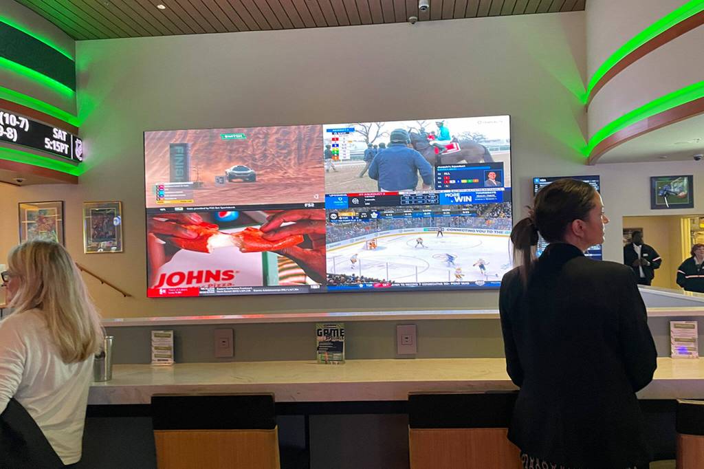 Sequim Gazette photo by Matthew Nash/ Cedars Sportsbook features a 24-foot video screen, and two adjacent 21- and 22-foot screens for watching sporting events inside 7 Cedars Casino.